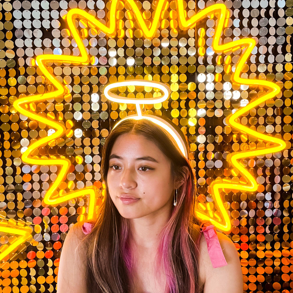 LED neon headband in warm white. Lights up with a supplied battery pack and can be customised.