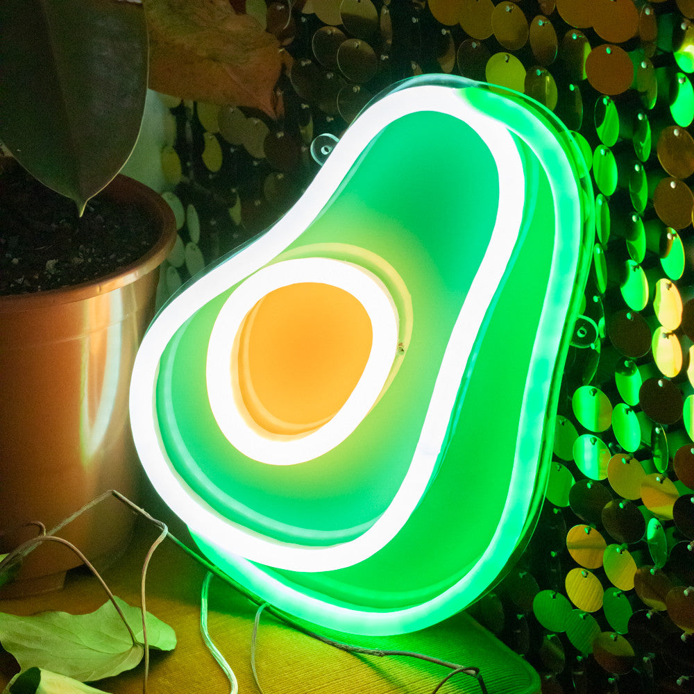 Avocado sign in duck egg and emerald neon mounted on a clear acrylic with a printed backing.